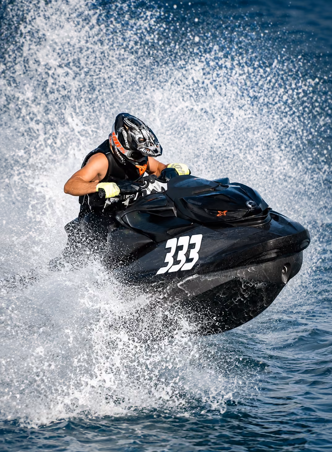 Jetski rider speeding across the water during an outdoor experience